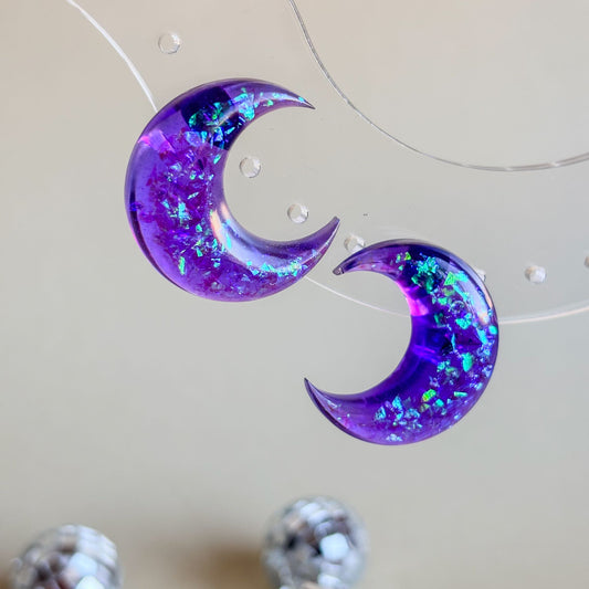 Pendientes mágicos en forma de luna de color morado translúcido